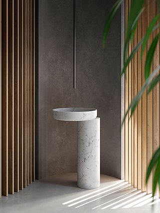 Minimalistisches Marmor-Waschbecken auf einem Sockel in einer Ecke mit Holzlatten.